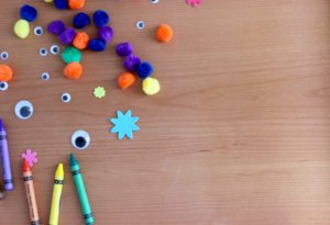kids craft supplies scattered on a tabletop