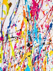 colorful paint splattered on a white background