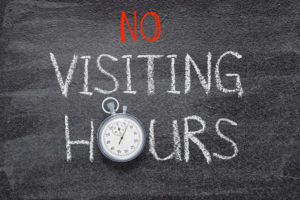 Chalkboard sign saying No Visiting Hours