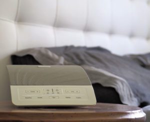 sound machine on a bedside table as it improves sleep