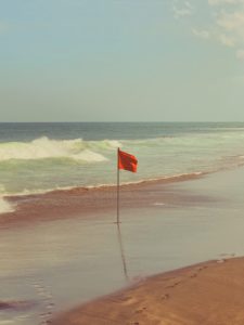 A red flag on a beach
