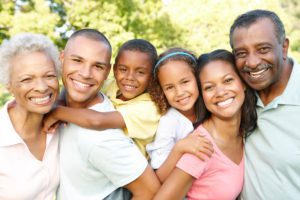Multi Generation African American Family Having Fun Together In Park