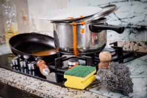 Messy kitchen with dirty cookware