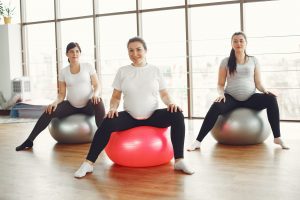 pregnant woman on exercise balls