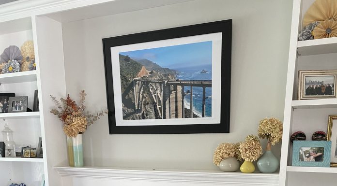 a fireplace with painted gray tile and white grout