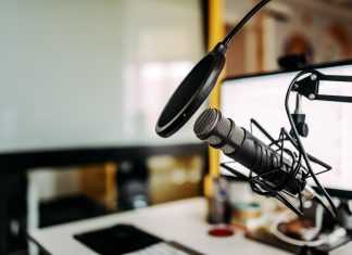 a studio with a microphone set up for a podcast