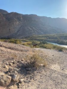 a spot in Big Bend National Park where the desert terrain meets up with a river by a mountain range