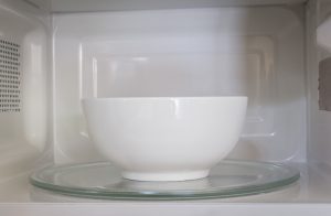 a ceramic bowl in a microwave