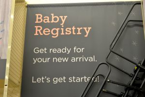A baby registry sign at a store