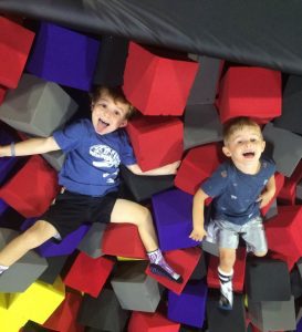 two toddler boys playing in a foam pit at Defy in Ballwin, MO