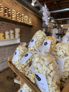 a photo of bags of popcorn on a shelf at Pop Culture in Overland Park in Kansas City
