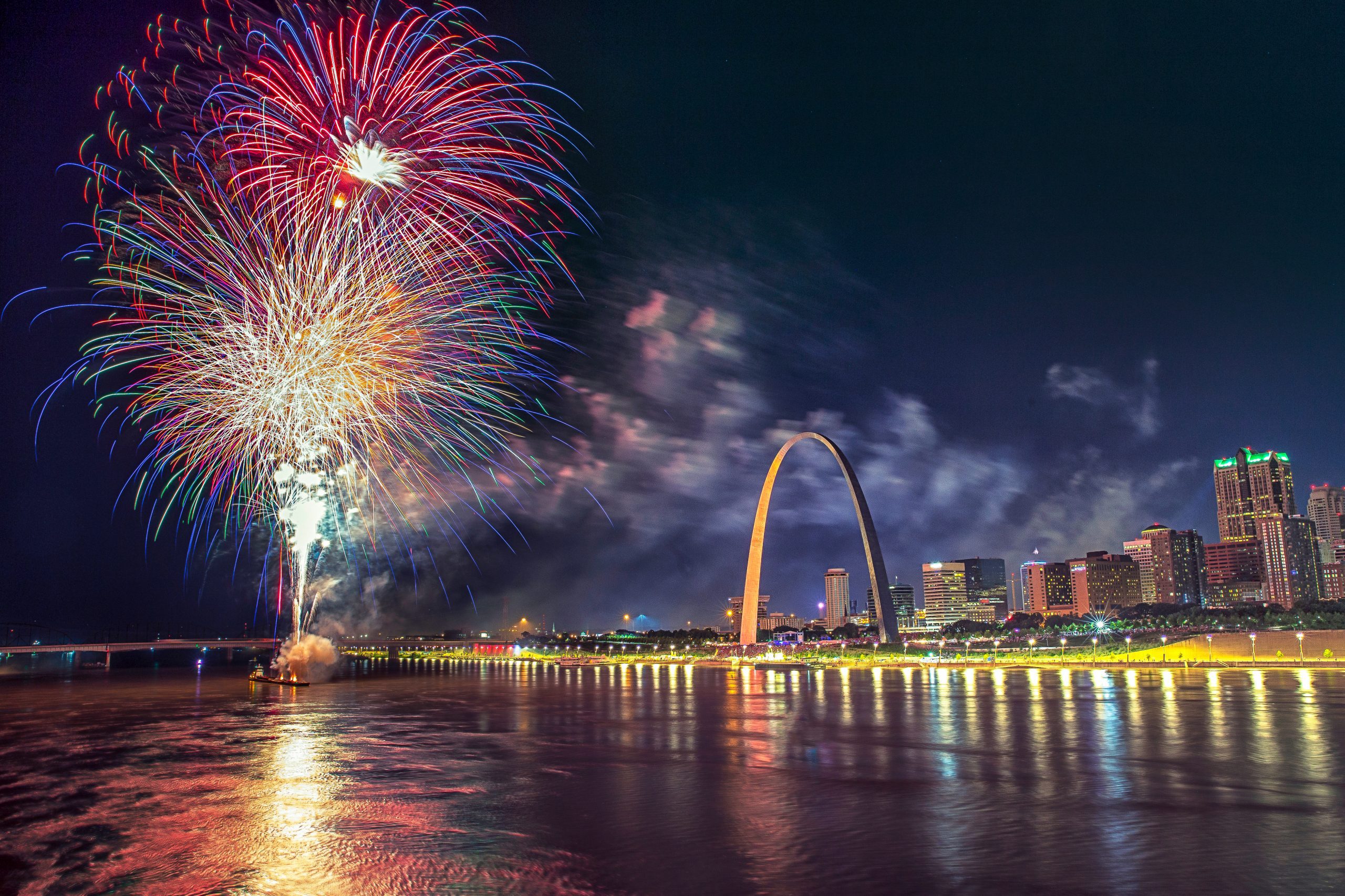 fireworks over the Mississippi River and the St. Louis arch at Fair St. Louis