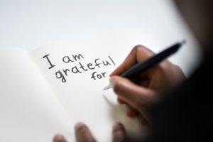 a journal with the words, "I am grateful for ..." written a the top of the page