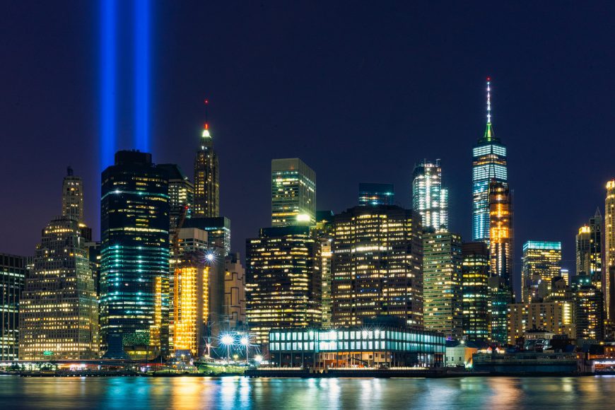 The New York skyline with bright lights shining in place of the Twin Towers