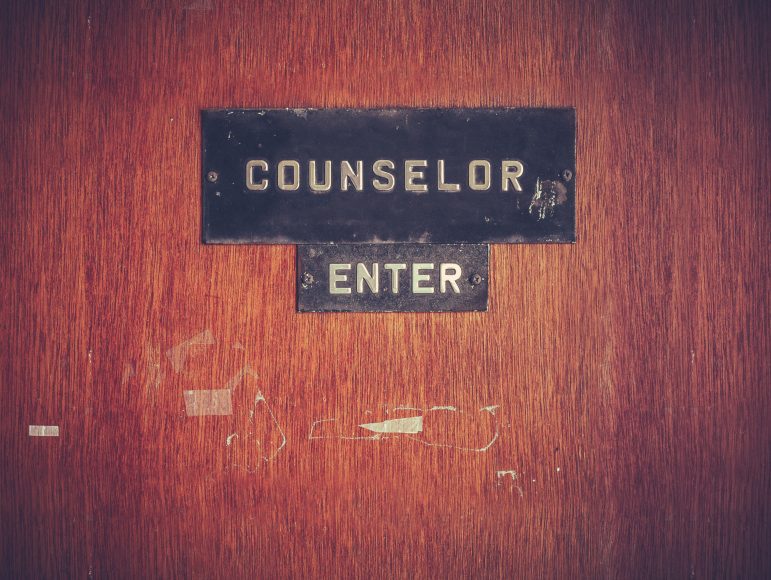 a wooden door with a sign saying, Counselor Enter