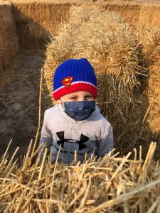 Josh in the hay bales at Heritage Farms