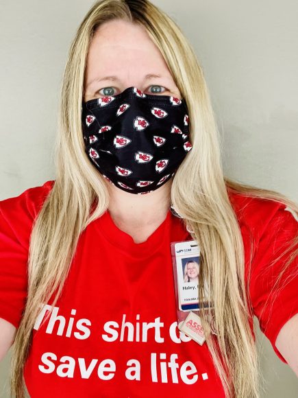 an injury prevention specialist wearing a badge and a shirt that says, “this shirt could save a life."