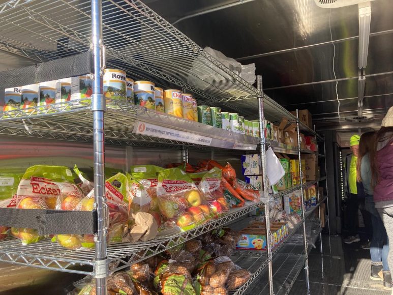 metal shelves holding donated food for St. Louis Area Foodbank