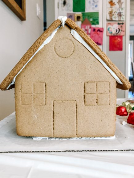 an assembled but undecorated gingerbread house