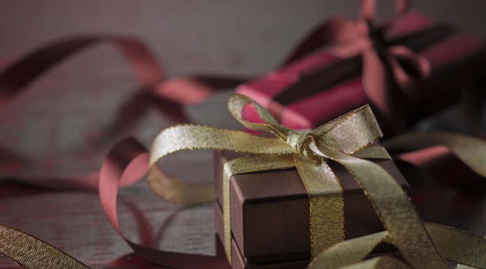 a gift box with ribbon. simple to signify having an intentional holiday season