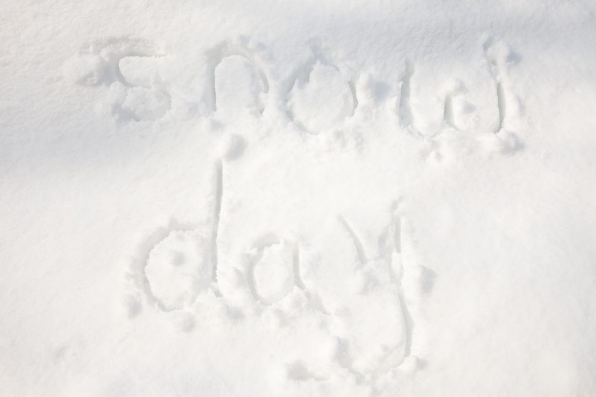 the words, “snow day” written in the snow