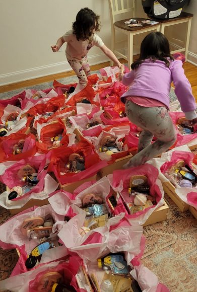 helpers stuffing the Galentine Crates