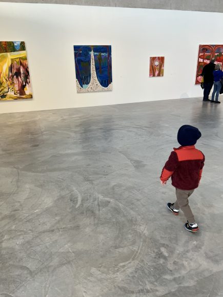 a child wandering through an art museum
