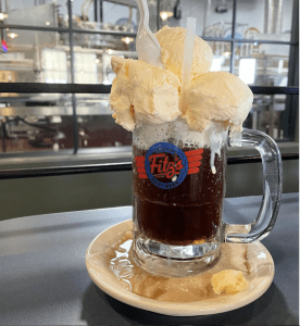 a giant root beer float in a mug that says Fitz’s, a famous restaurant and bottling company in St. Louis, MO 