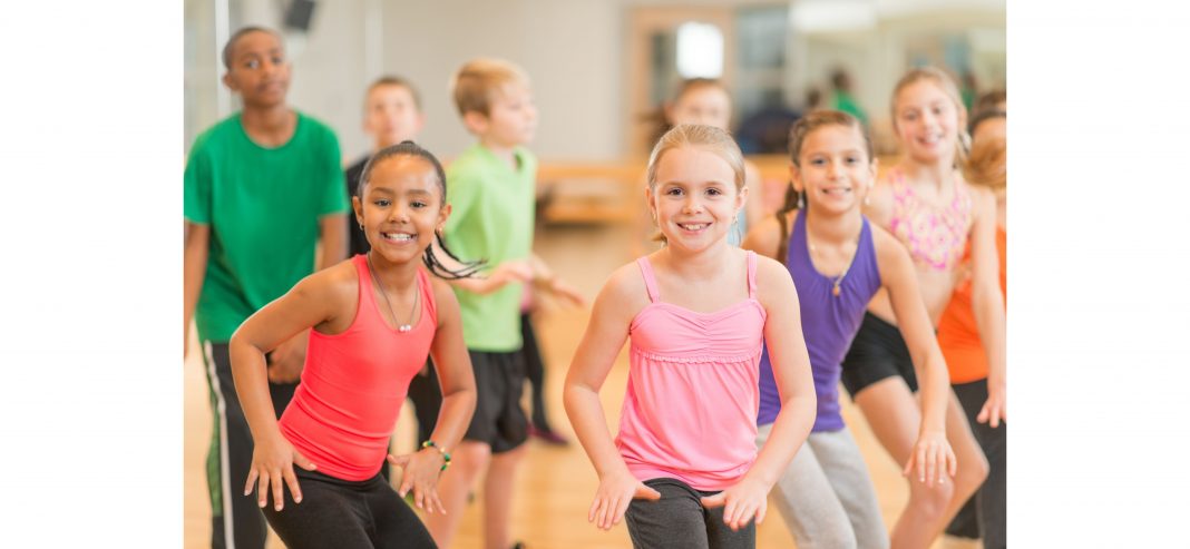 a group of kids in a dance class