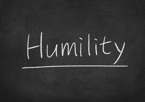 humility concept word on a blackboard background