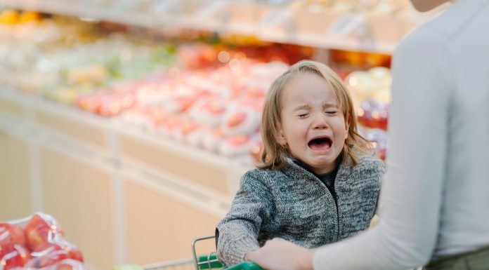 a child having a meltdown in a grocery store