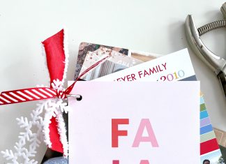 a stack of holiday photo cards wrapped with ribbon