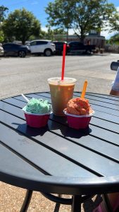 two gelatos and a coffee on a patio table at Gelato Di Riso in Kirkwood, MO