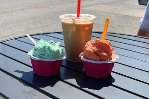 two gelatos and a coffee on a patio table at Gelato Di Riso in Kirkwood, MO