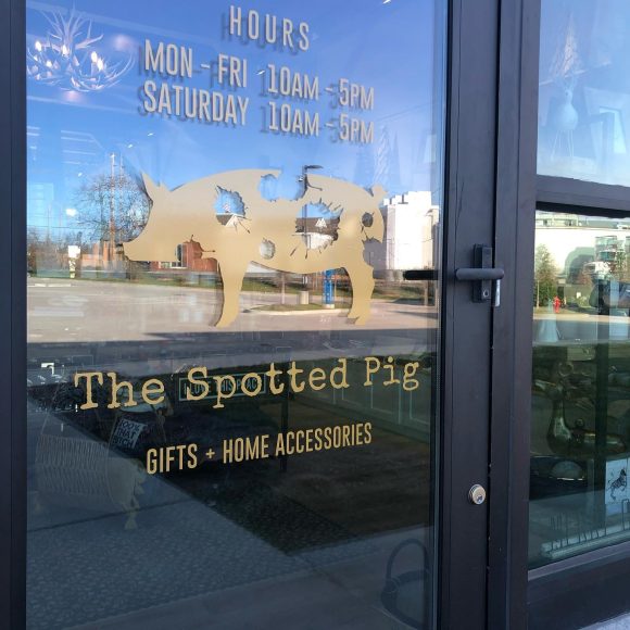 The Spotted Pig logo on their storefront door in St. Louis