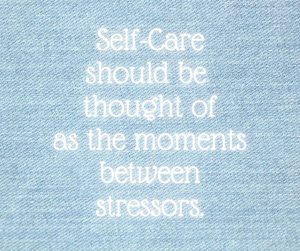 a quote, “self-care should be thought of as the moments between stressors” in white font on a soothing, light blue background