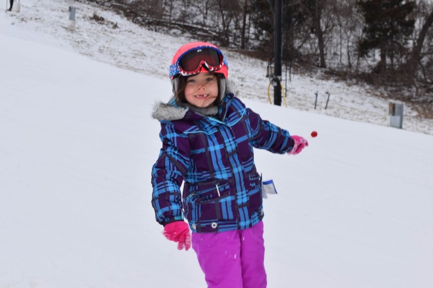 a child in ski gear on a mountain side at Hidden Valley Ski in St. Louis