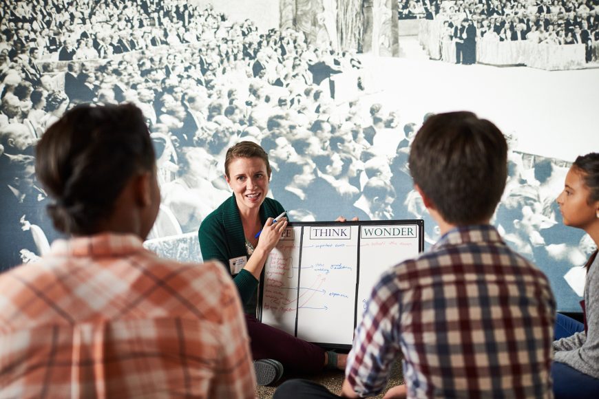 a woman leading a discussion at History Exploration Days at the Missouri History Museum in St. Louis