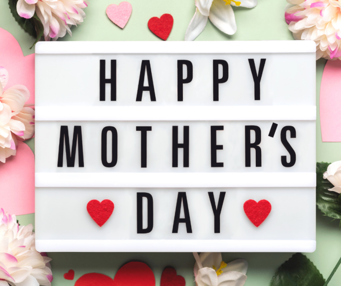 a Lightbox, surrounded by flowers and hearts, that says, "Happy Mother' Day"