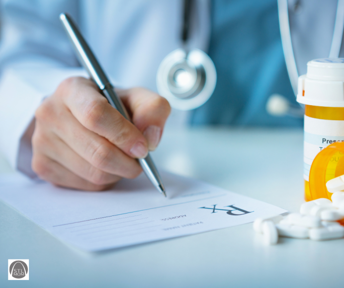 close up of a doctor writing a prescription for psychiatric medications