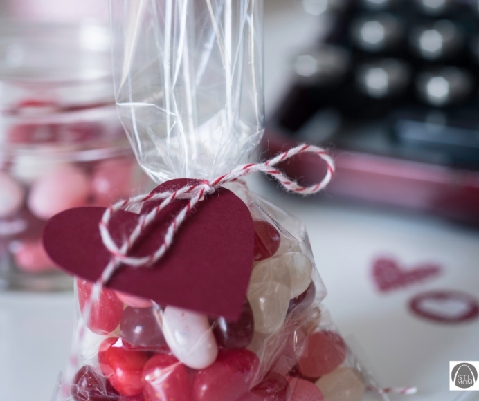 a bag of red, pink, and white jelly beans tied with a bow for a special galentine's friend