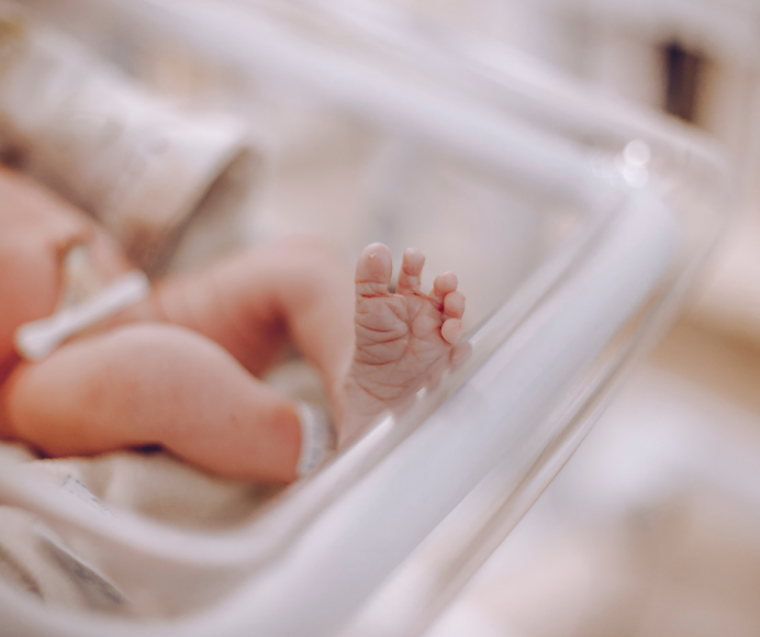 a close up of a newborn baby's feet 