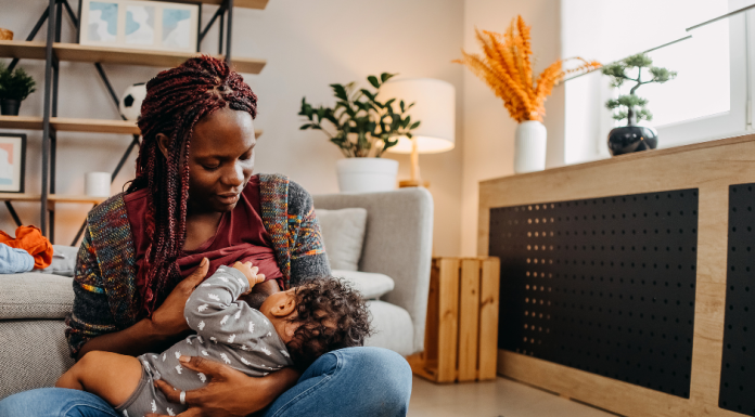 a Black woman breastfeeding her baby