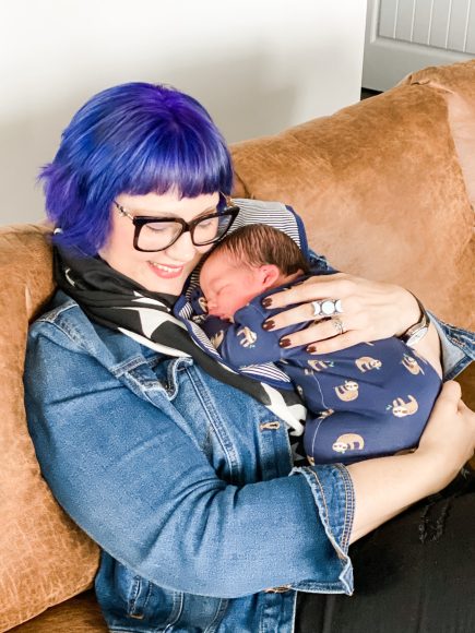 grandma holding first grand baby