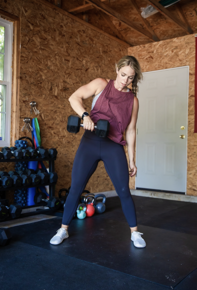 a woman strength training by lifting weights