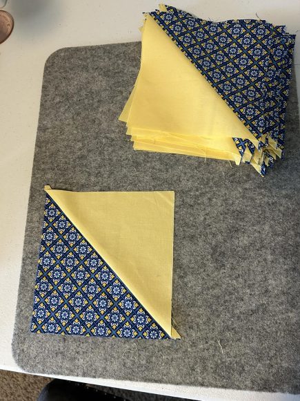 quilting squares on a table representing the simple hobbies of the grandma era 