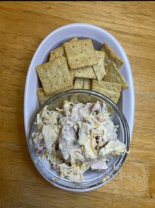 a lunch plate with bacon chicken ranch salad and crackers