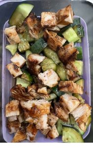 a pyrex with cucumber chicken salad for lunch