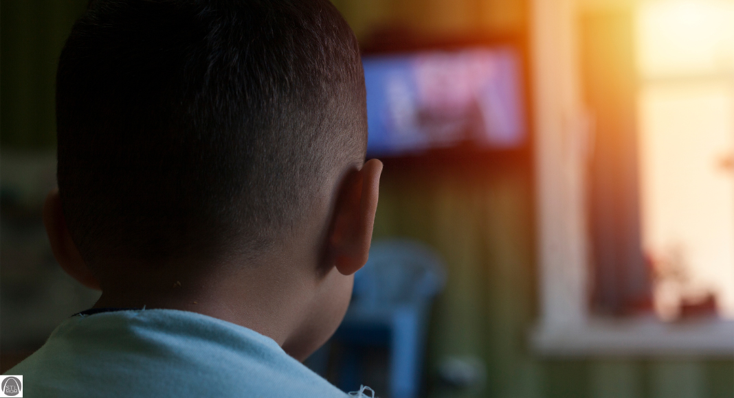 a boy watching tv