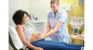 a midwife with her hands on a pregnant woman's belly